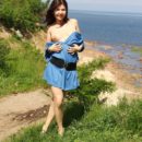 Smiling girl Vika near gulf of Finland