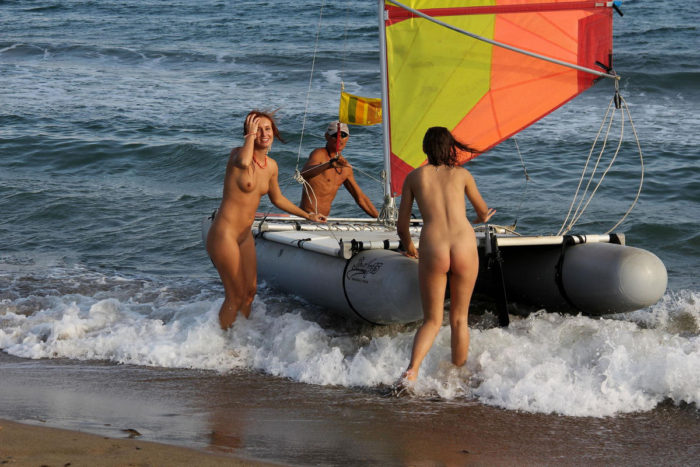 Two bare girls on various sea transports