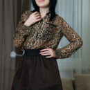 Ramina takes off her animal printed long sleeves and black skirt, revealing her pink and puffy nipples and her shaved pussy with suckable clit.