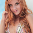 Roberta Berti lounges by the poolside wearing a sexy bikini that shows off her spectacular physique.