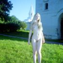 Russian blonde Elza with slender body walks at park