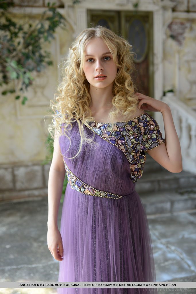Taking off her flowy purple dress, a vision of the naked goddess Angelika D with smooth porcelain skin and heavenly assets can be captivating to any mere mortal.