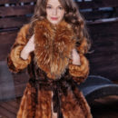 A luxurious soft fur hugging Nedda A’s delightfully nubile body and fresh assets, complimenting her youthful beauty.