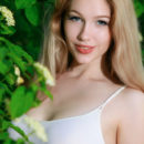 Gorgeous blonde Genevieve Gandi shows off her amazing body outdoors.