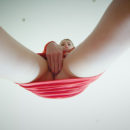 Kalisy satisfies her shaved snatch with a blue dildo