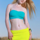 Fay Love s youthful beauty, her smooth porcelain skin, and nubile body stands out in the bright, sunny outdoor.