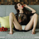 Leona Mia strips on the couch baring her petite body and sweet cherry.