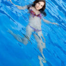 Oretha Mars teasing looks as she takes a swim in the pool, until she takes a sensual shower on the bathtub.