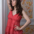 Tanya Grace flaunts her beautiful knockers as she strips on the bed.