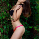 Emmy sensually poses in the forest baring her gorgeous physique.