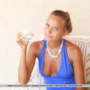 Mango A enjoys showing off her gorgeous tanned body as she strips her blue dress in front of the camera