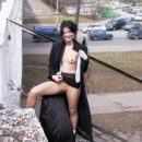 Nude russian brunette posing at railroad