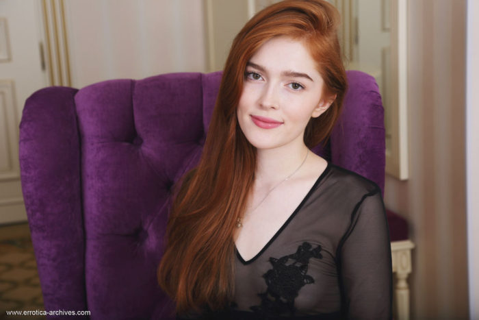 Redhead Jia Lissa flaunts her sweet pussy ass he poses on the chair.