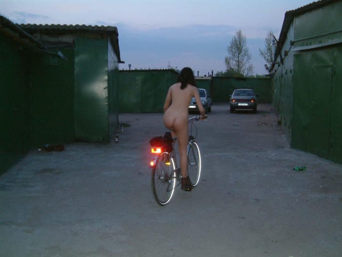 Crazy brunette masturbates with bycicle and beer bottle at garages