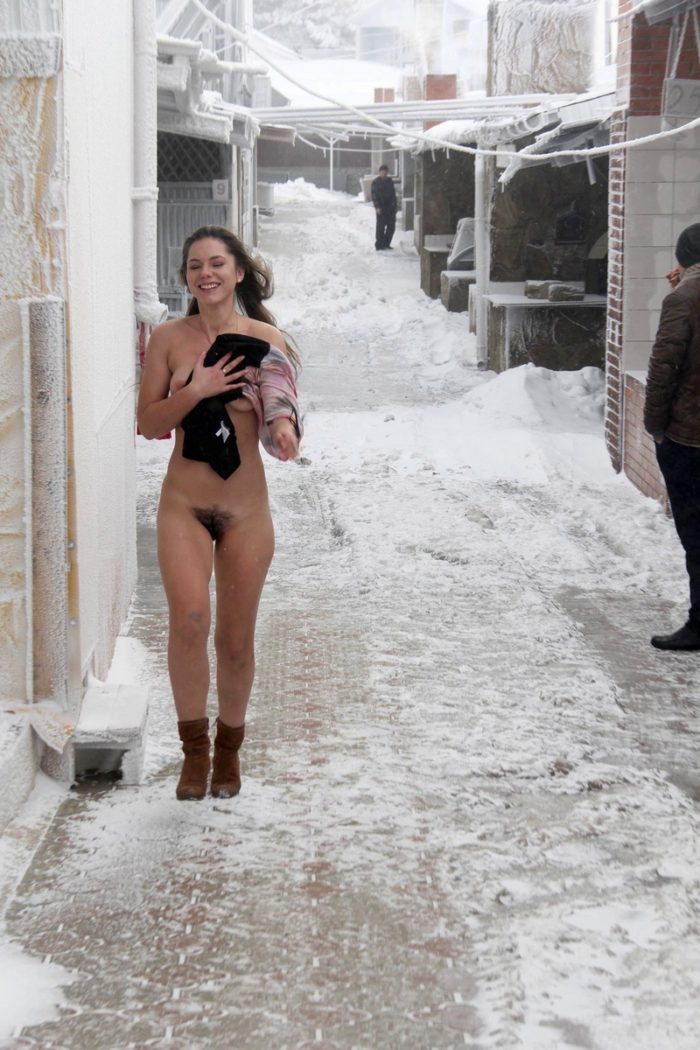 Girl with a hairy pussy walks through very cold streets