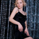 Hilary Wind strips her black dress as she displays her delectable pussy.