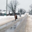 Naked girl walks on the winter road
