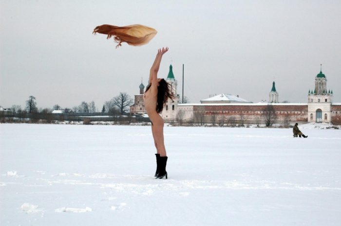 Russian teen Tamara K plays with shawl at snow field