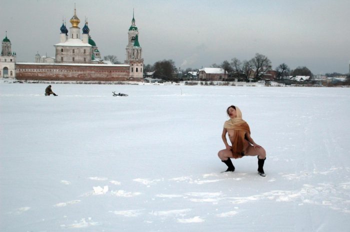 Russian teen Tamara K plays with shawl at snow field