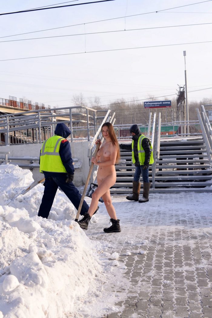 Sexy russian girl with nice boobs helps workers with snow