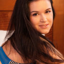 An unobstructed view of Ottolain s curvy body with full, cuppable breasts, shapely thighs, and meaty butt as she lays sprawled on top of the bed.