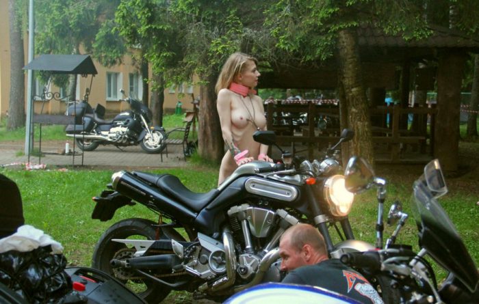 Crazy russian blonde posing in front of many bikers
