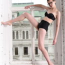 Jerricka sensually strips by the window as she bares her slender, creamy body.