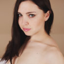 Oliviana strips naked on the bed then bares her gorgeous body and delectable pussy.