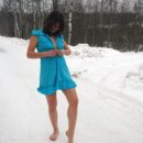 Sexy dame undresses outdoors at winter