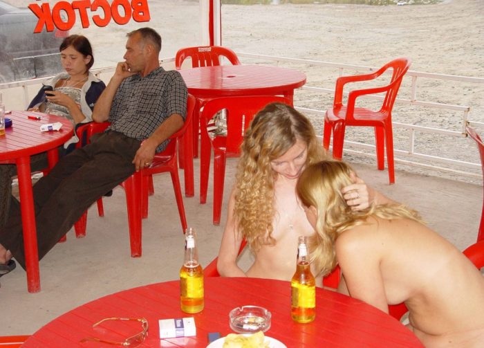 Young russian blondes drink beer and lick pussies at outdoors cafe