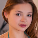 Cute and charming Colleen A in her two-piece bikini that adds to her girly appeal.