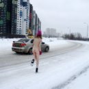 Blonde Seshat walks naked at road