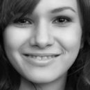 Demetra A is an unshaved beauty, an exqusite site to behold. Adorable in her white knee socks she exposes her lovely feminine bush.