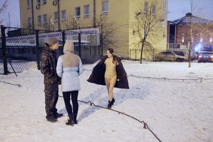 Girl Zhenja undresses at city streets
