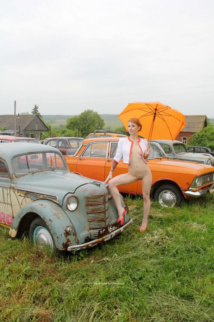 Russian babe Eva Gold at retro cars museum