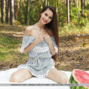 Top model Leona Mia bares her petite body and pink pussy as she eats her watermelon.