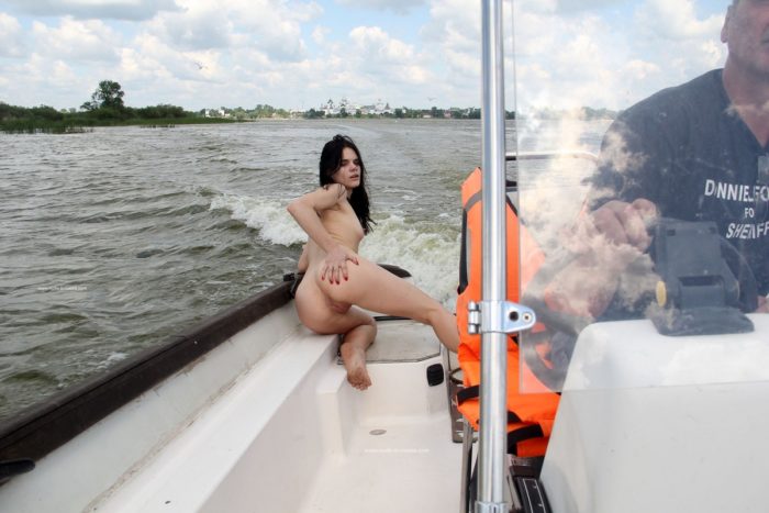 Brunette Daria widely spreads legs to show her holes on boat