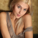 Dandela is pleasing to the eyes with her tight young body and luscious tan while she seductively opens up to the camera and shows off her amazingly delectable pussy and perky tits.