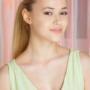 Dressed in a chiffon dress, her hair tied up in a high ponytail, a sweet charming smile lighting up her pretty face, Samera is an enchanting new model posed casually on top of teh couch