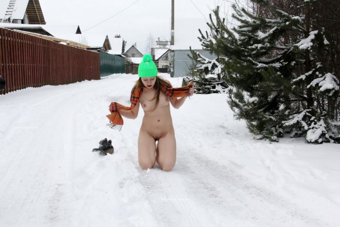 Hot Angelika posing doggy at snow road