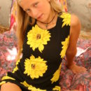 Luba B is sweet in her sunflower dress and shows off her hairy pussy.