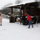 Naked Angelika plays with snow