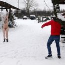 Naked Angelika plays with snow