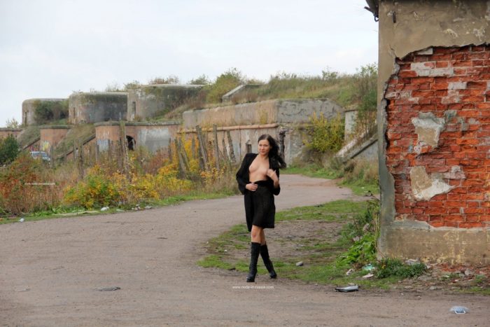 Naked brunette Masha S posing at public place