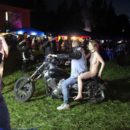 Naked girl Eva Gold rides a motorcycle