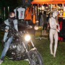 Naked girl Eva Gold rides a motorcycle