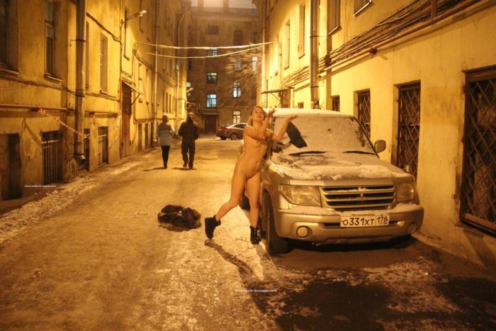 Naked girl Zhenja plays with a snow at night
