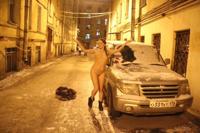 Naked girl Zhenja plays with a snow at night