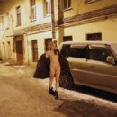 Naked girl Zhenja plays with a snow at night