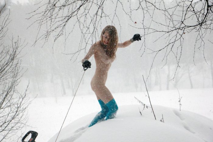 Sexy russian blonde posing outdoors during snowfall